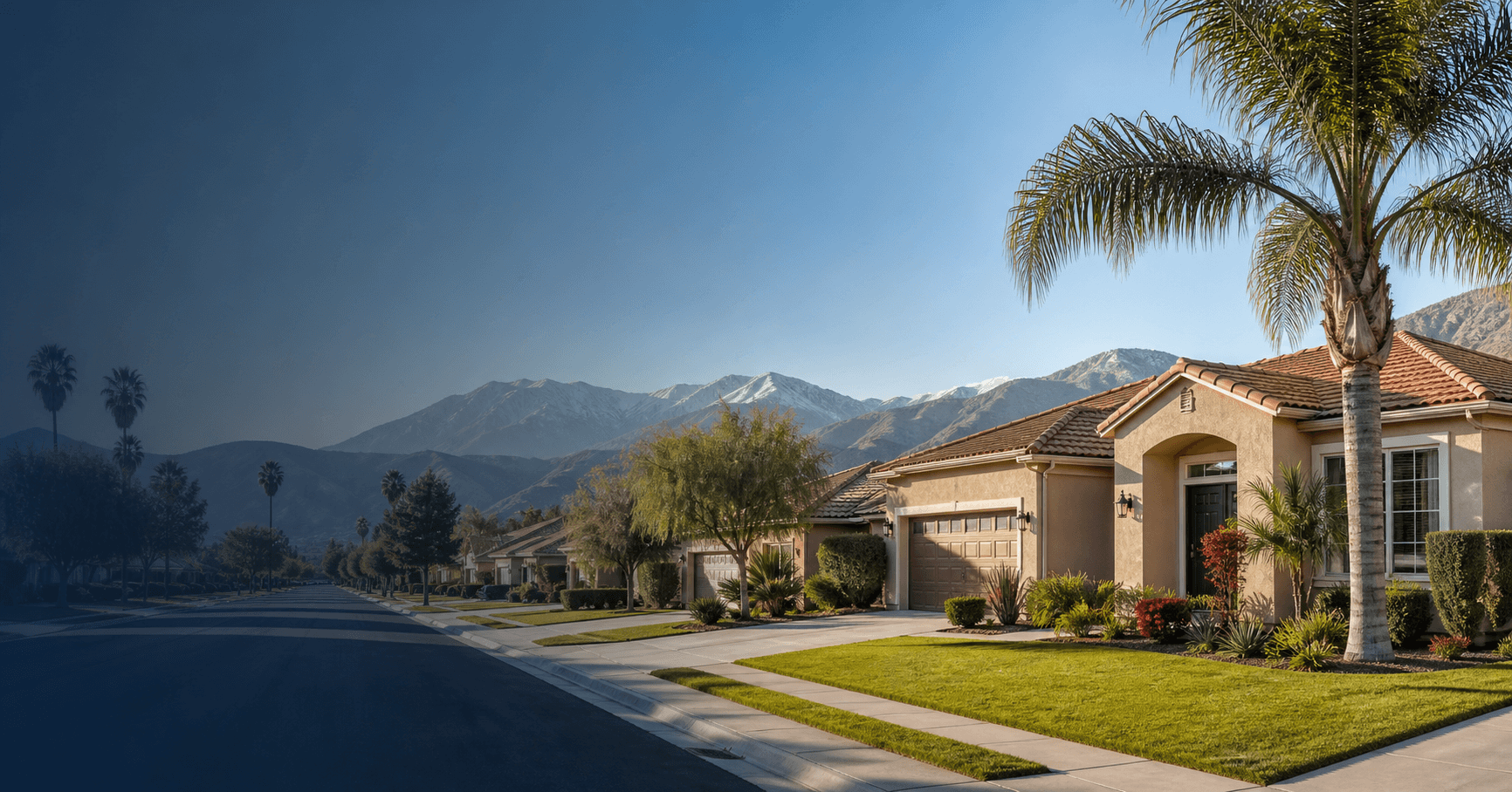Well-kept Inland Empire suburban home with palm trees and mountains in the background