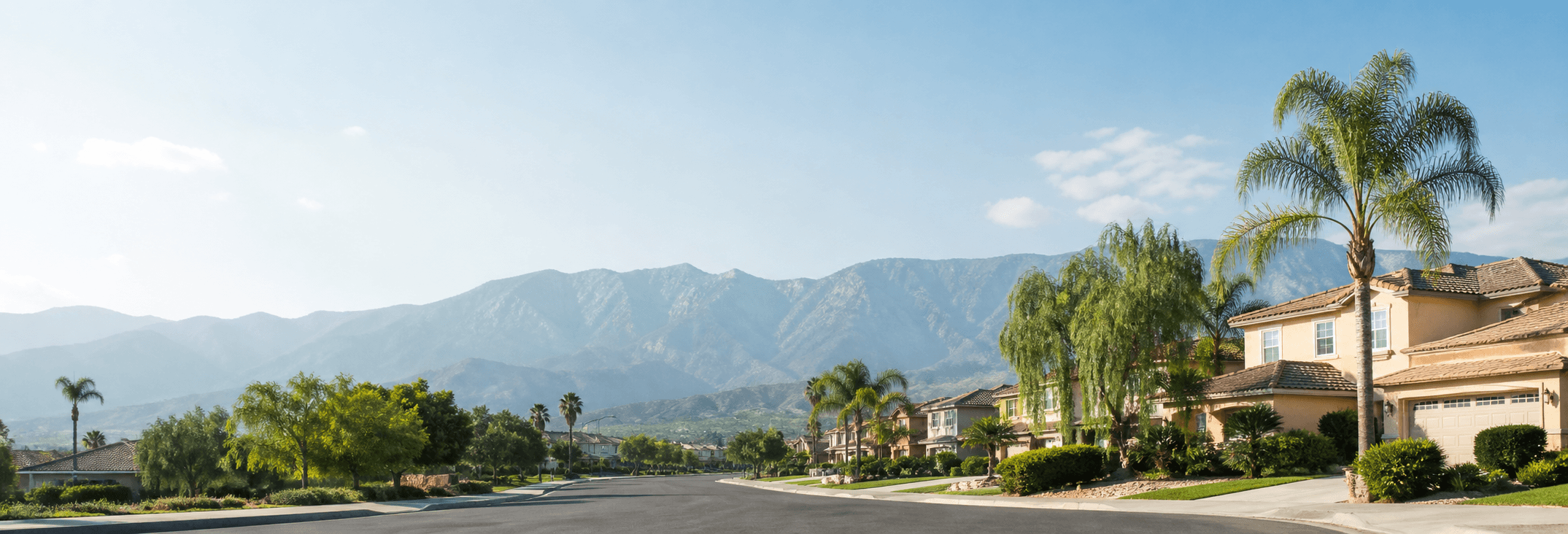 Inland Empire suburban neighborhood street with mountains in the background