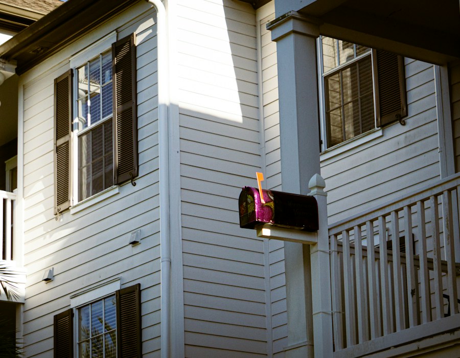 Mailbox in front of a white residence
