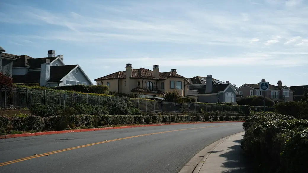 Houses along a gently sloping suburban street