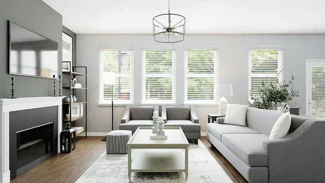 Bright staged living room with a light sectional sofa