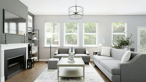 Bright staged living room with a light sectional sofa