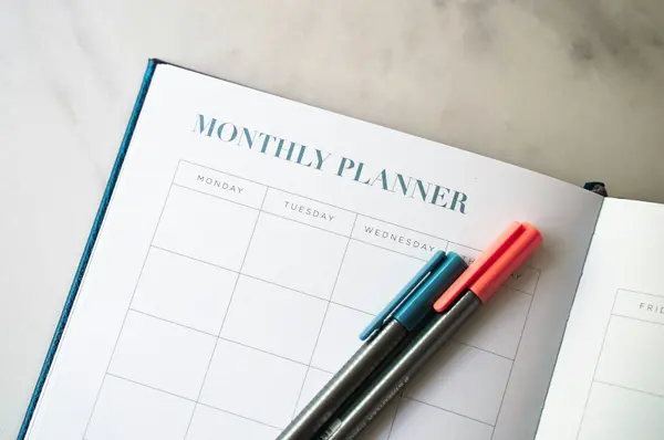 Monthly budget planner open on a desk