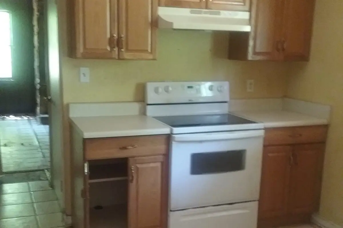 Step2_OfferDated kitchen with oak cabinets before renovation