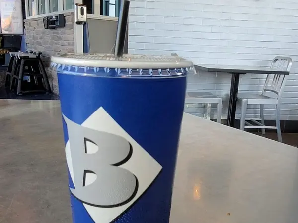 Blue Baker cup on a table inside Blue Baker in College Station