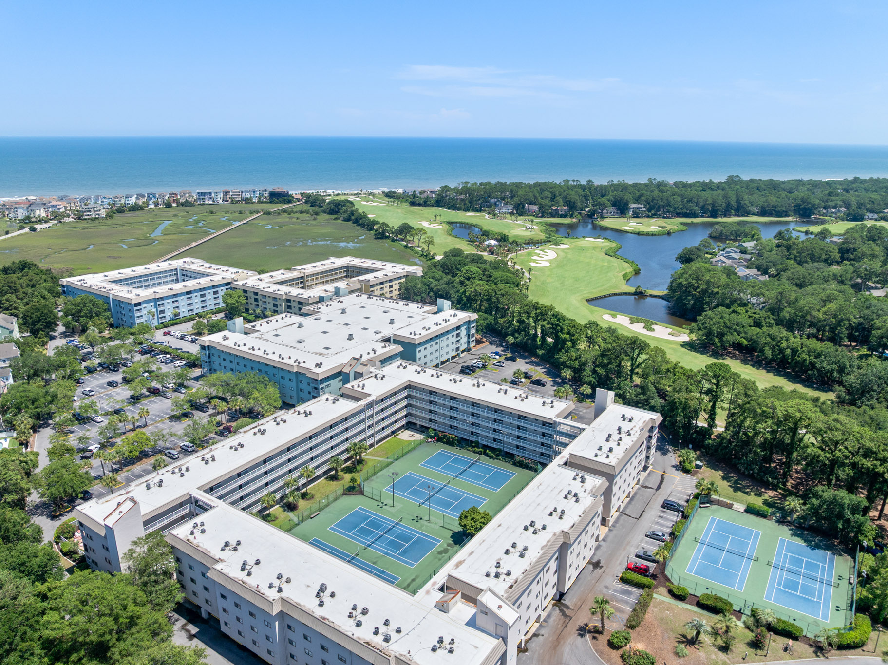 Building 4 tennis courts (unit 4431's building) with golf course and ocean beyond